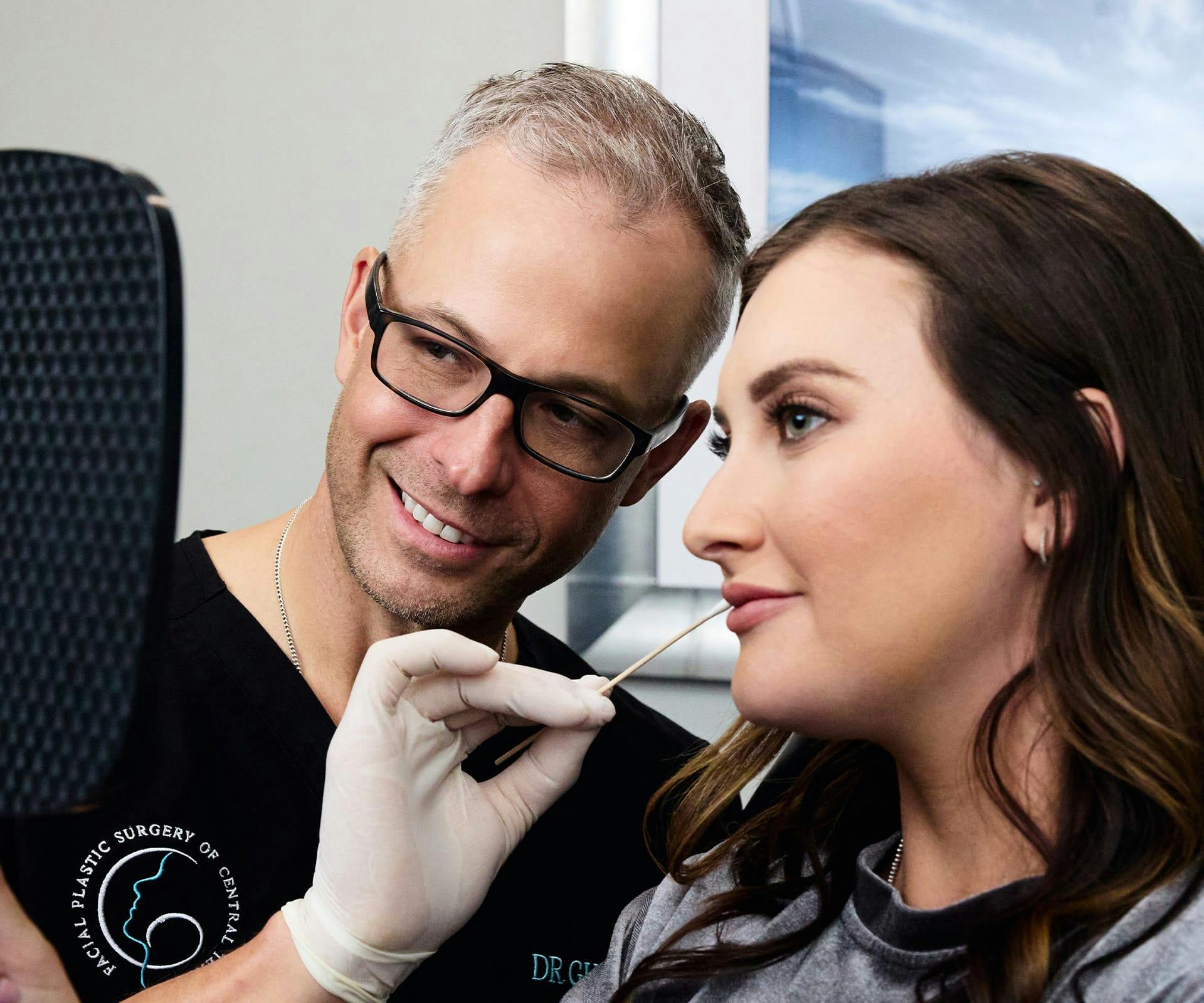 Dr. Guy showing patient her face